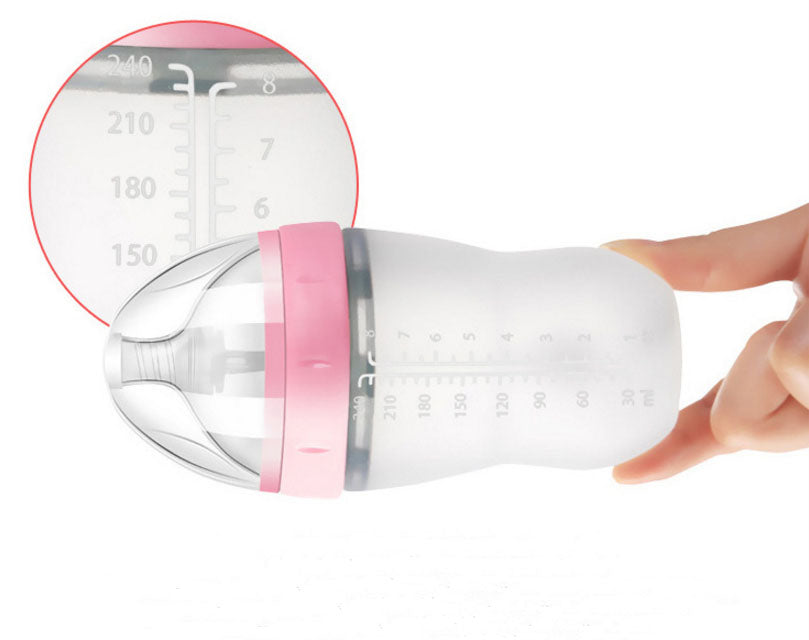 Baby's bottle with spoon